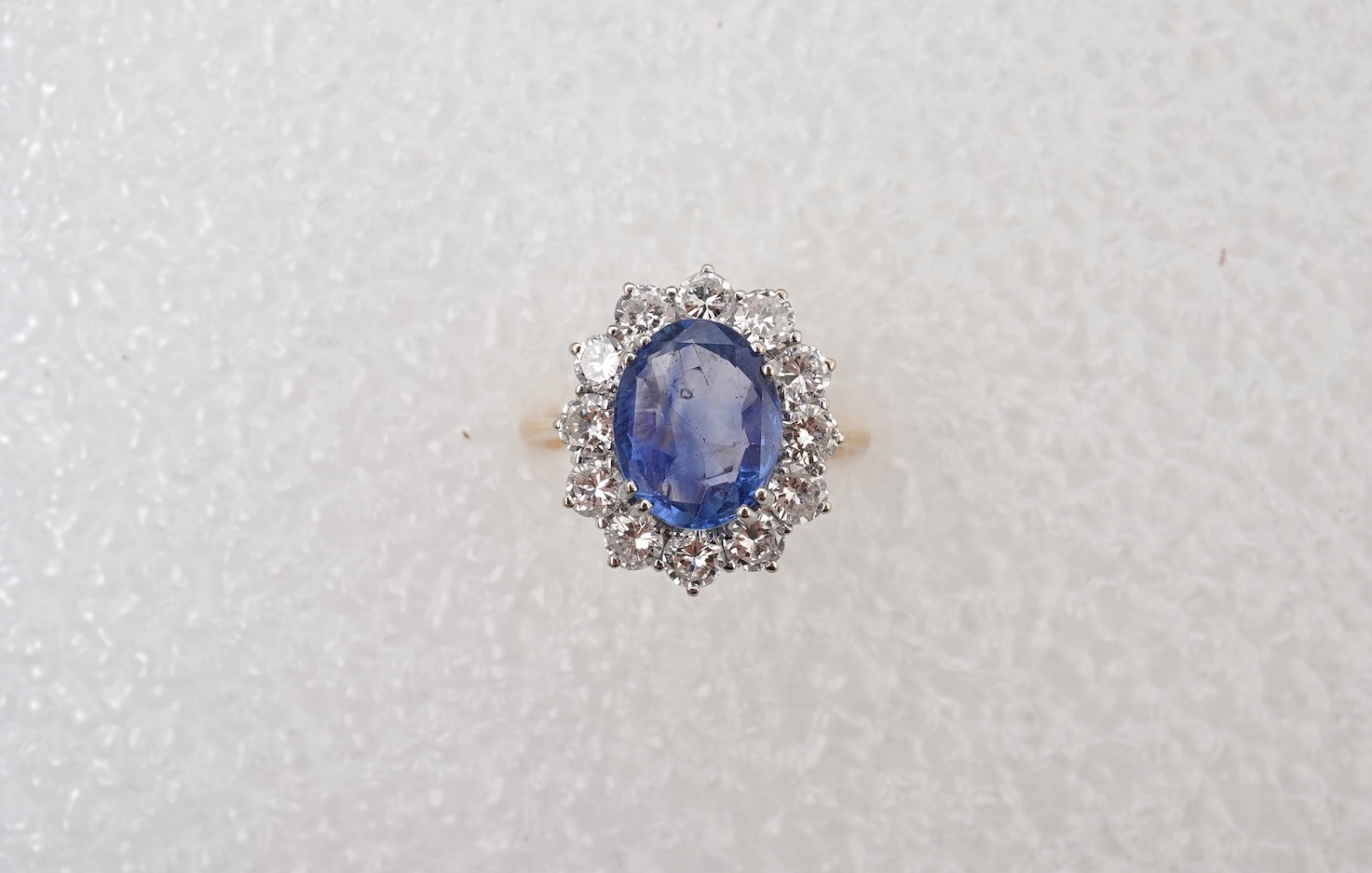 A sapphire and diamond cluster ring